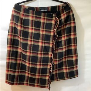 Woman’s plaid wool wrap skirt. Knee length. Has liner